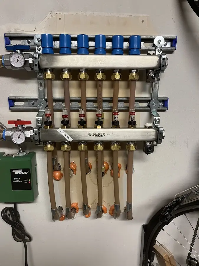 Plumber performing Water Heater Repair at a residential property in Millersburg